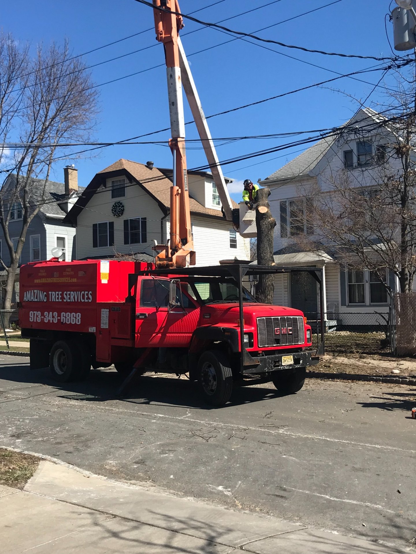 Branded chip truck on residential street during job
